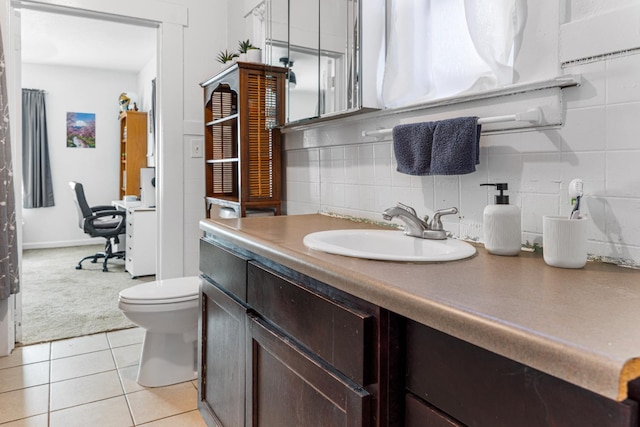 1586 N Calaveras St, Fresno, CA 93728 - bathroom featuring toilet, vanity, backsplash, and tile patterned floors