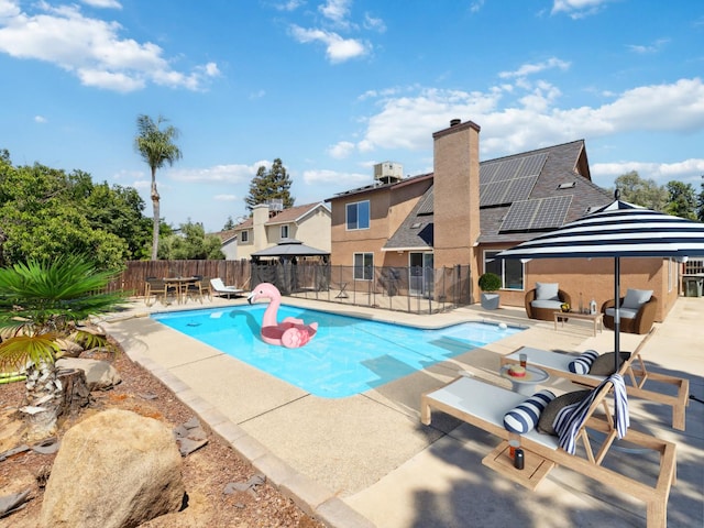 2091 E Cromwell Ave, Fresno, CA 93720 - view of swimming pool featuring a patio and a fenced backyard