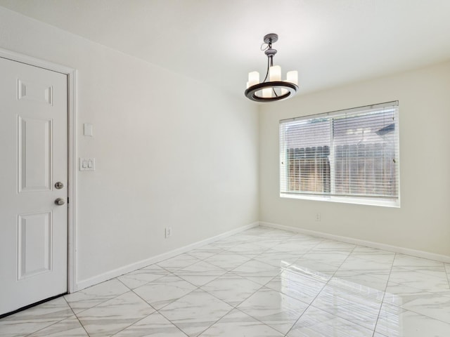 2091 E Cromwell Ave, Fresno, CA 93720 - spare room with a chandelier and light marble finish floors
