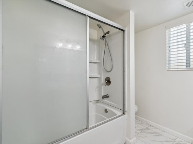 2091 E Cromwell Ave, Fresno, CA 93720 - bathroom featuring marble look tiles and shower / bath combination with glass door