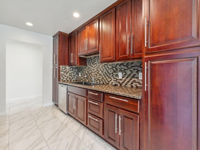 2091 E Cromwell Ave, Fresno, CA 93720 - kitchen with stainless steel dishwasher, light marble finish floors, dark stone countertops, decorative backsplash, and dark brown cabinets