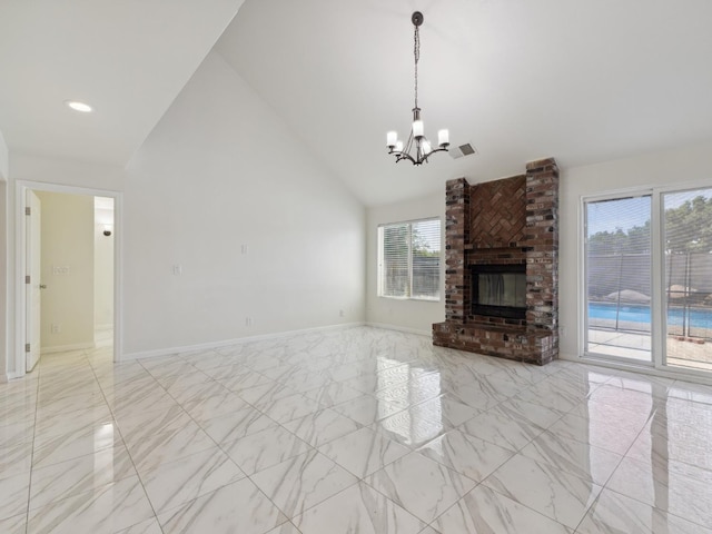 2091 E Cromwell Ave, Fresno, CA 93720 - unfurnished living room with light marble finish flooring, a chandelier, high vaulted ceiling, and a brick fireplace