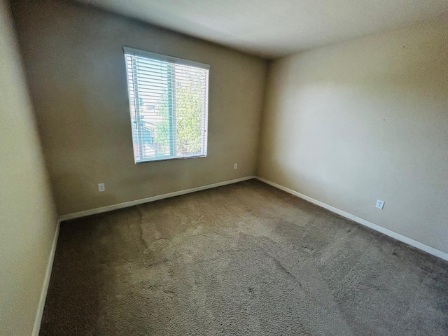 5795 E Beck Ave, Fresno, CA 93727 - spare room featuring baseboards and carpet