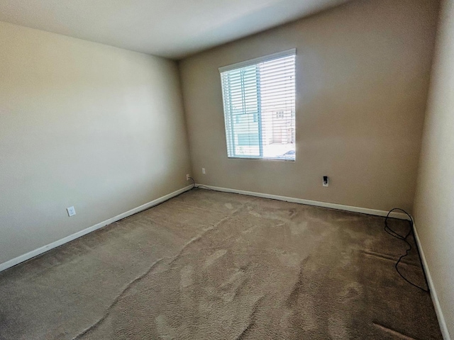 5795 E Beck Ave, Fresno, CA 93727 - carpeted empty room featuring baseboards
