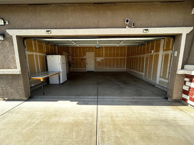 5795 E Beck Ave, Fresno, CA 93727 - garage with freestanding refrigerator and concrete driveway
