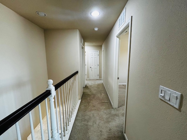 5795 E Beck Ave, Fresno, CA 93727 - hall with carpet flooring, recessed lighting, an upstairs landing, and a textured wall