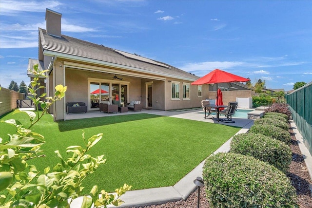 11753 N Turf Dr, Fresno, CA 93730 - rear view of house featuring an outdoor living space, ceiling fan, stucco siding, a patio, and a chimney