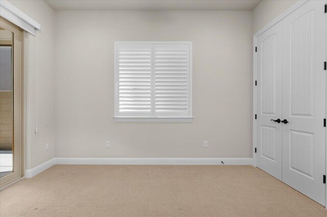 11753 N Turf Dr, Fresno, CA 93730 - unfurnished bedroom with carpet flooring, a closet, and baseboards