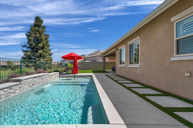 11753 N Turf Dr, Fresno, CA 93730 - view of pool with a fenced backyard and a patio area