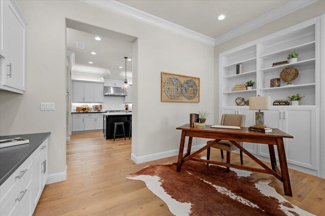 11753 N Turf Dr, Fresno, CA 93730 - office space featuring crown molding, light wood-style flooring, baseboards, recessed lighting, and built in features