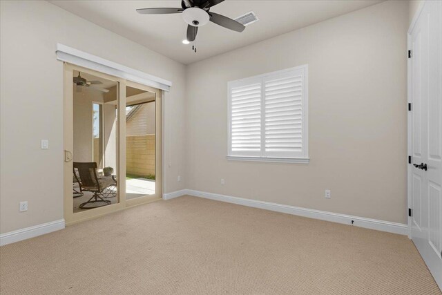 11753 N Turf Dr, Fresno, CA 93730 - unfurnished bedroom featuring access to outside, carpet, multiple windows, and baseboards