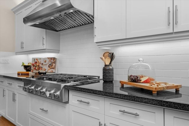 11753 N Turf Dr, Fresno, CA 93730 - kitchen with ventilation hood, backsplash, stainless steel gas cooktop, and dark stone countertops