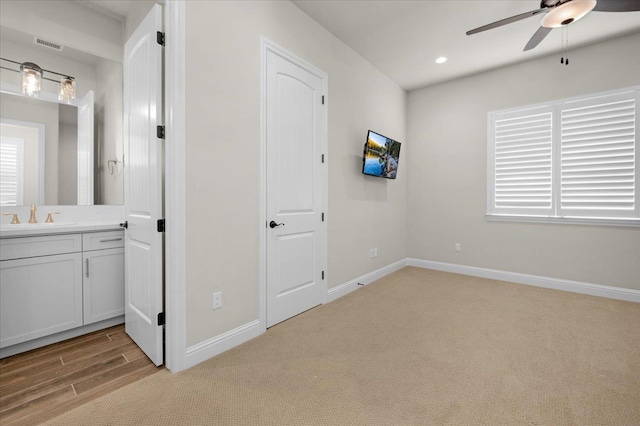 11753 N Turf Dr, Fresno, CA 93730 - unfurnished bedroom with a sink, carpet floors, baseboards, recessed lighting, and ensuite bath