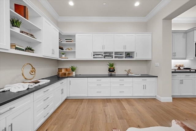 11753 N Turf Dr, Fresno, CA 93730 - kitchen featuring open shelves, ornamental molding, dark countertops, light wood-style flooring, and white cabinets