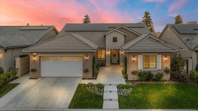 11753 N Turf Dr, Fresno, CA 93730 - traditional-style house featuring a garage, a front lawn, driveway, and stucco siding