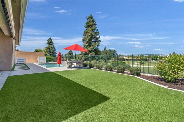 11753 N Turf Dr, Fresno, CA 93730 - view of yard featuring a patio area