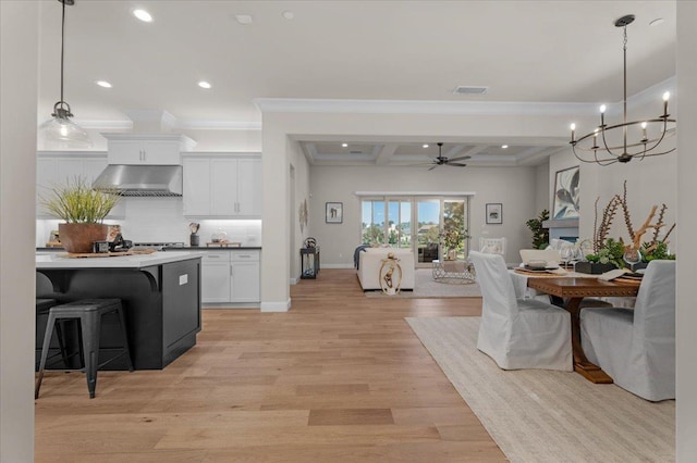 11753 N Turf Dr, Fresno, CA 93730 - dining area with ceiling fan, recessed lighting, coffered ceiling, light wood finished floors, and beamed ceiling