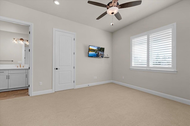 11753 N Turf Dr, Fresno, CA 93730 - unfurnished bedroom with light carpet, baseboards, connected bathroom, recessed lighting, and a ceiling fan