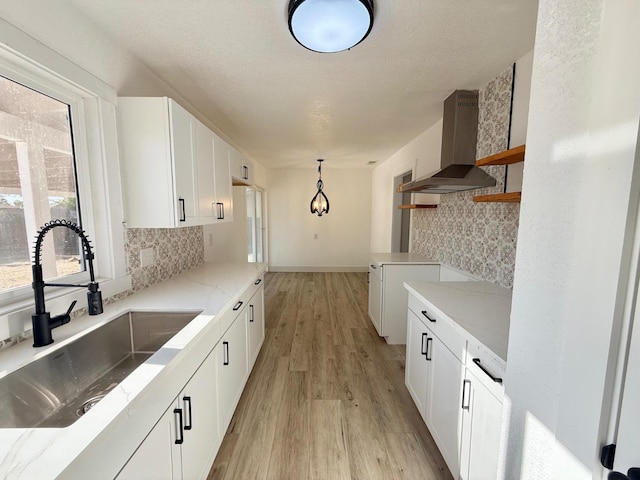 1310 Fresno St, Madera, CA 93638 - kitchen with island exhaust hood, a sink, open shelves, decorative backsplash, and white cabinets