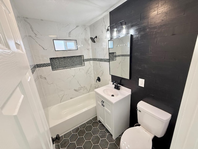 1310 Fresno St, Madera, CA 93638 - bathroom featuring vanity, shower / bathtub combination, toilet, tile patterned flooring, and wooden walls