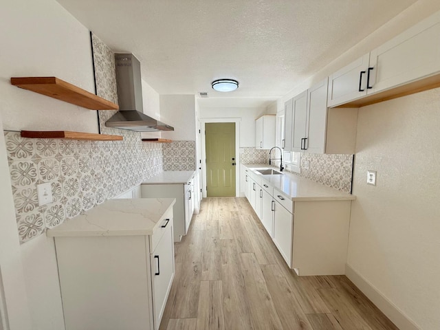 1310 Fresno St, Madera, CA 93638 - kitchen with island exhaust hood, a sink, light wood finished floors, decorative backsplash, and open shelves