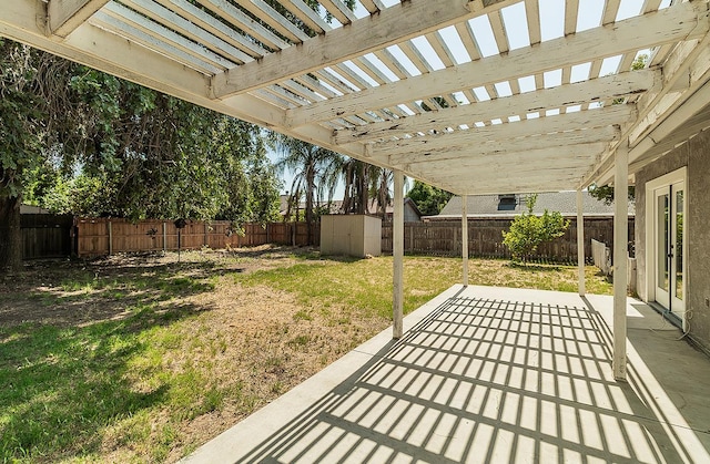 709 Keith St, Lemoore, CA 93245 - fenced backyard with a shed, a patio, and a pergola