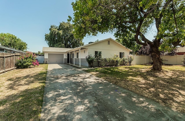 709 Keith St, Lemoore, CA 93245 - ranch-style house with concrete driveway and a garage