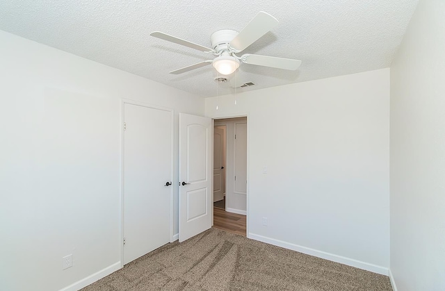 709 Keith St, Lemoore, CA 93245 - spare room with ceiling fan, carpet floors, and a textured ceiling