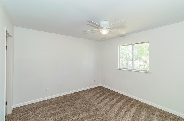 709 Keith St, Lemoore, CA 93245 - unfurnished room featuring a ceiling fan and dark colored carpet