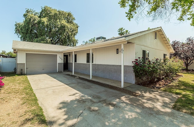 709 Keith St, Lemoore, CA 93245 - ranch-style home with a garage and concrete driveway
