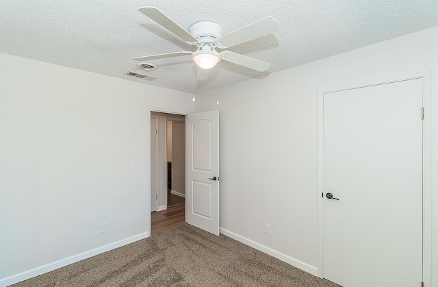 709 Keith St, Lemoore, CA 93245 - unfurnished bedroom featuring carpet floors, a textured ceiling, and a ceiling fan
