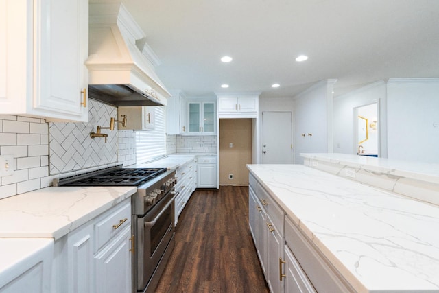 2048 W Sierra Ave, Fresno, CA 93711 - kitchen with stainless steel range, custom exhaust hood, white cabinetry, dark wood-type flooring, and ornamental molding