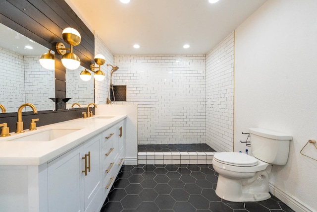 2048 W Sierra Ave, Fresno, CA 93711 - full bathroom featuring toilet, double vanity, tile patterned floors, walk in shower, and recessed lighting