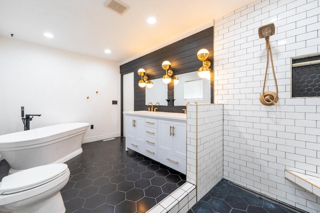 2048 W Sierra Ave, Fresno, CA 93711 - full bath featuring double vanity, recessed lighting, a freestanding tub, tile patterned flooring, and a tile shower