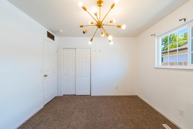 2048 W Sierra Ave, Fresno, CA 93711 - unfurnished bedroom featuring a chandelier, carpet floors, a closet, and baseboards