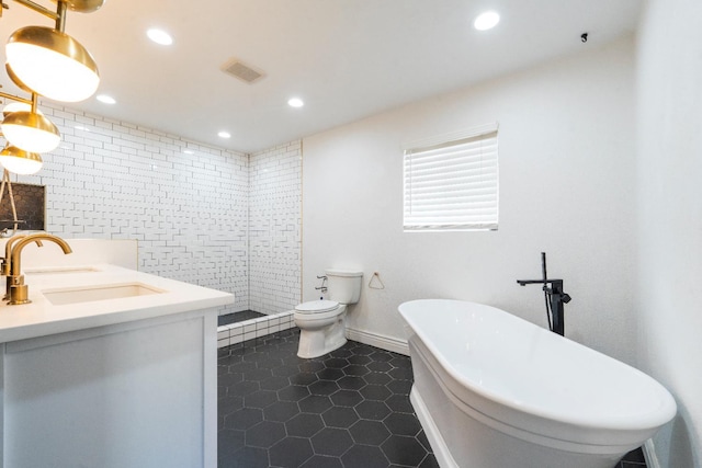 2048 W Sierra Ave, Fresno, CA 93711 - bathroom featuring a soaking tub, double vanity, tile patterned flooring, recessed lighting, and toilet