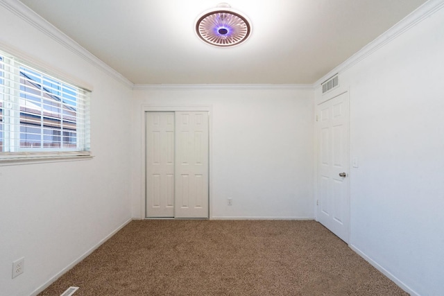 2048 W Sierra Ave, Fresno, CA 93711 - unfurnished bedroom featuring carpet flooring, crown molding, baseboards, and a closet