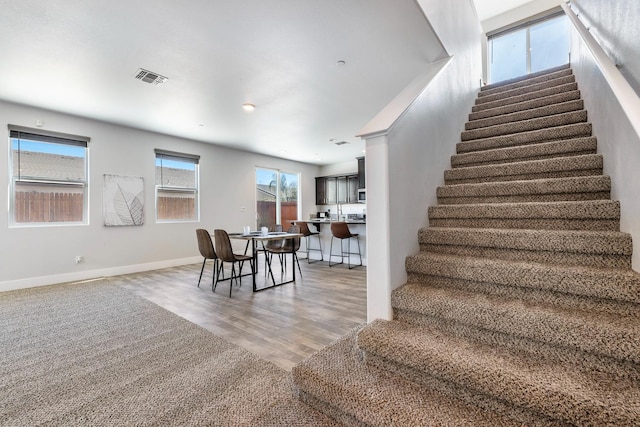 1276 Sauret St, Madera, CA 93638 - stairway with wood finished floors and baseboards