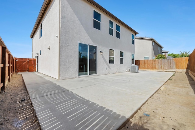 1276 Sauret St, Madera, CA 93638 - back of property featuring stucco siding, a patio area, and a fenced backyard