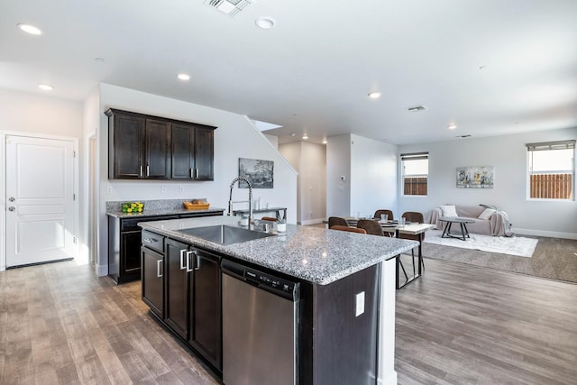 1276 Sauret St, Madera, CA 93638 - kitchen with stainless steel dishwasher, a sink, open floor plan, healthy amount of natural light, and recessed lighting