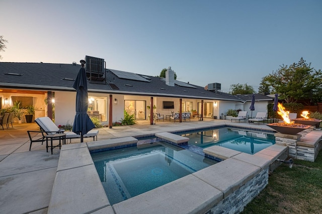 3841 W Alluvial Ave, Fresno, CA 93711 - view of swimming pool with a fire pit, a patio, a pool with connected hot tub, central AC, and outdoor dining area