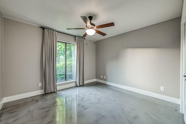 3841 W Alluvial Ave, Fresno, CA 93711 - spare room featuring finished concrete floors, a ceiling fan, and baseboards