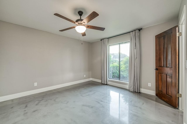 3841 W Alluvial Ave, Fresno, CA 93711 - spare room with finished concrete flooring, baseboards, and ceiling fan