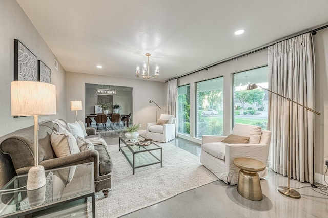 3841 W Alluvial Ave, Fresno, CA 93711 - living room with a chandelier, concrete floors, and recessed lighting