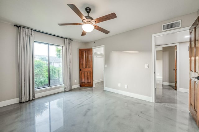3841 W Alluvial Ave, Fresno, CA 93711 - unfurnished bedroom featuring concrete flooring, baseboards, and ceiling fan