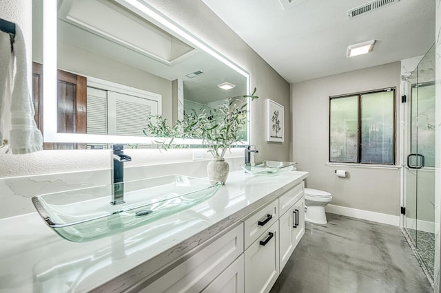 3841 W Alluvial Ave, Fresno, CA 93711 - bathroom featuring double vanity, baseboards, a marble finish shower, toilet, and concrete flooring