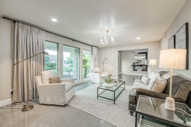 3841 W Alluvial Ave, Fresno, CA 93711 - living room featuring a chandelier, concrete floors, recessed lighting, and baseboards