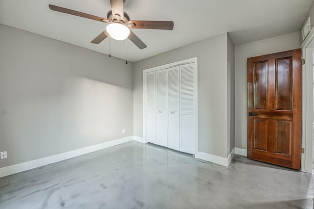 3841 W Alluvial Ave, Fresno, CA 93711 - unfurnished bedroom featuring concrete flooring, a closet, baseboards, and ceiling fan