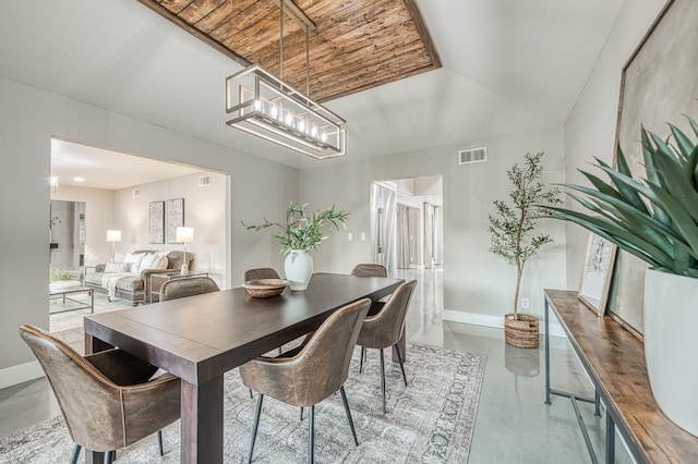 3841 W Alluvial Ave, Fresno, CA 93711 - dining space featuring baseboards, finished concrete flooring, and a chandelier