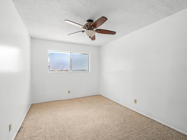 6413 N 5th St, Fresno, CA 93710 - spare room featuring ceiling fan, carpet floors, a textured ceiling, and baseboards